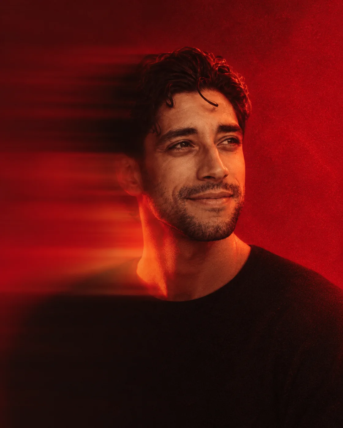 Alfredo AK Metoyer in a red editorial portrait